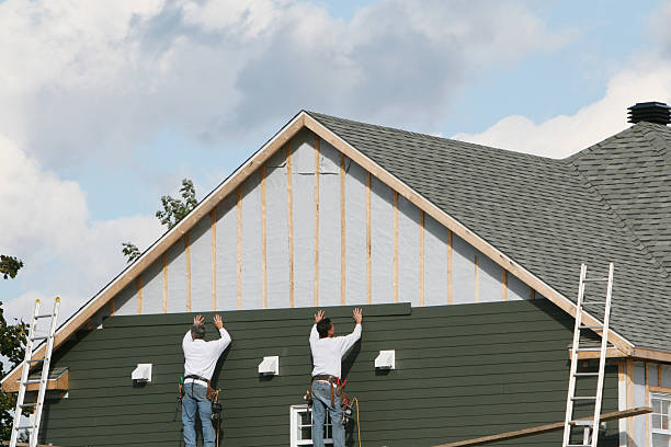 Professional Siding Repair technician working in Harrison, NJ